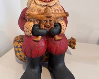 "Santa Sitting on His Bag." Hand-Carved, Hand-Painted by American Carver Bob Stebleton (Maine) 1997. Measures 12.5" H x 10.5" W..  Photo 1 of 2 