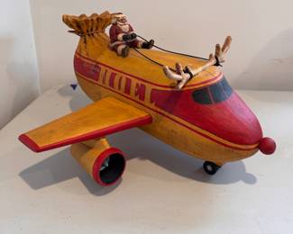 "Santa on Airplane Noel Express," Hand-Made Folk Art Santa by American Carver Bob Stebleton (Maine). 1996. Measures 10/5" W x 19.5" L. Photo 1 of 3. 