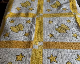 Yellow Quilt with Stars and Butterflies. 