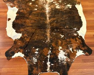  05 Large Natural Cowhide Rug Featuring a Striking Brindle Pattern with Rich Brown, Black, and White Col