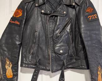 Black Harley Davidson Motorcycle Jacket with FXR, Superglide and Flame Patches
No size tag but believed to be a size Large
