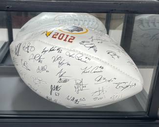 Signed Washington Redskins 2012 football in case 