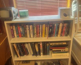 Book cases, DVDs, cassettes, books, cookbooks.  Vintage tv/radio