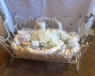 Vintage doll cradle  and porcelain dolls