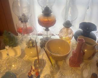 Lots of different sized hurricane lamps