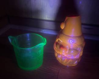 Uranium measuring cup and vintage Fenton amberine Santa candle. Both glow in the dark!!