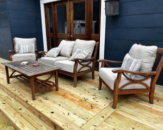 Teak Patio Set with Cushions and covers.
Set retails for over $2500
Incudes tan cushions, not smaller decorative cushions. 
Wood needs some oil. 
Chairs measure: 29” across x 30” deep x 18” tall to seat, 35” tall to back
Table measures: 4’ x 25” x 19” tall
Loveseat measures: 52” across x 30” deep.
Must be able to move and load yourself.