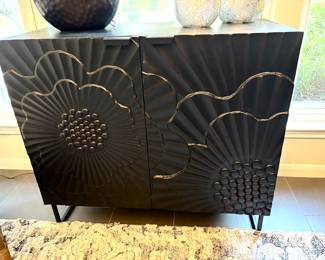 Distinctive black wood carved cabinet