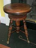 antique piano or organ stool with glass ball and claw feet