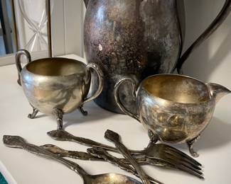 Silverplate pitcher and utensils