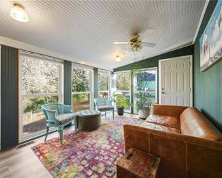 Leather Couch, Rug, Indoor Plants, Art