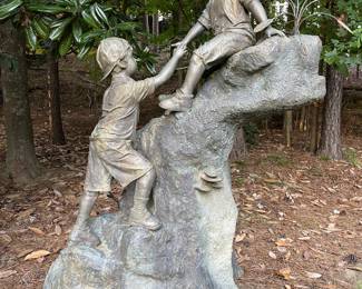 Bronze sculpture of two young boys playing on a rock formation. This is a huge piece of art 6 feet  3 inches tall and it is about 4 feet 5 inches wide. This is a rare piece that we WILL presell because of the size and unique nature.  Contact us for details. 