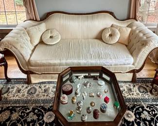 Hollywood regency sofa and vitrine table.  NOTE: This one blue carpet is NOT for sale all of the other carpets in the home are offered for sale.  