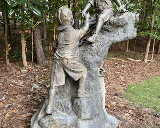 Bronze sculpture of two young boys playing on a rock formation. This is a huge piece of art 6 feet  3 inches tall and it is about 4 feet 5 inches wide. This is a rare piece that we WILL presell because of the size and unique nature.  Contact us for details. 