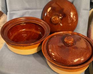 Brown-glazed stoneware casserole dishes with lids