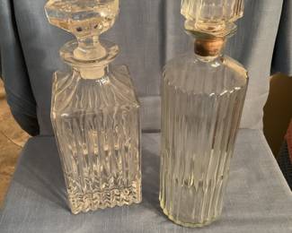 Large selection of crystal and glass pieces including cake stands, pitchers, bowls, trays, decanters, vases and candlesticks