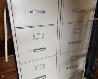 pair of metal filing cabinets