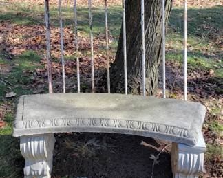 Concrete bench.  Section of old metal fence