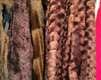 Several Dennis Basso faux fur coats.  Both new and barely worn pieces 