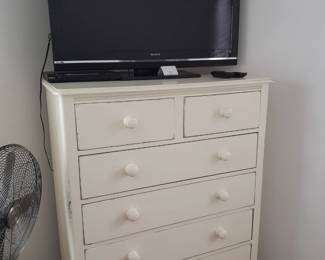 White dresser, flat screen television