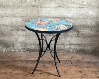 This lot features a Kai Flower mosaic table that measures, 30” H x 28” W x 28” D.

