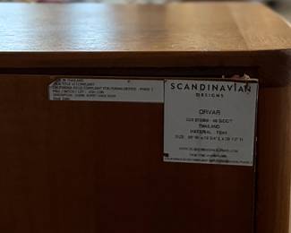 This lot features the Orvar sideboard by Scandinavian Designs. Crafted in teak, this cabinet measures, 29.5” H x 66” W x 20” D. Three large drawers and two cabinets provide ample space for hosting and dining accoutrement.


