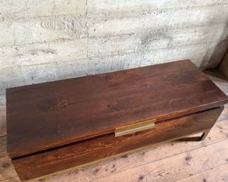 This lot features a modern provincial style flip top trunk, made of mango wood. This chest measures, 17.5” H x 51” W x 18” D.

