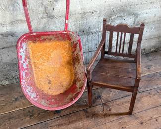 This lot features an antique children’s chair and child’s size wheelbarrow.

