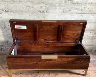 This lot features a modern provincial style flip top trunk, made of mango wood. This chest measures, 17.5” H x 51” W x 18” D.

