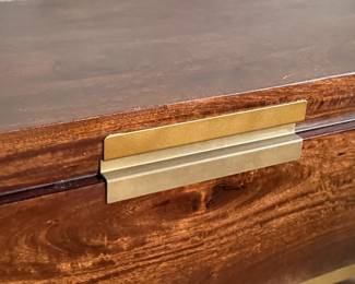 This lot features a modern provincial style flip top trunk, made of mango wood. This chest measures, 17.5” H x 51” W x 18” D.

