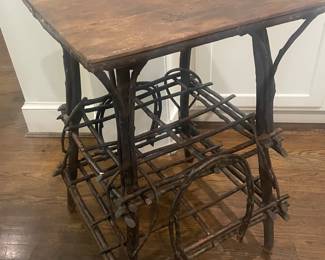 Vintage Primitive Adirondack “Twig Table”. Handmade from willow branches that have been bent & configured to form shapes. Shelf & splay legs. The craftsmanship is wonderful. $280
The table is hand painted with gold markings throughout the legs.
Twigs were bent to form ornamental horse shoes on two sides.