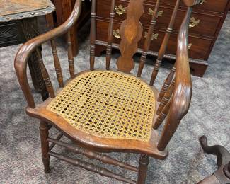 One of a Pair Early Cane Bottom Armchairs