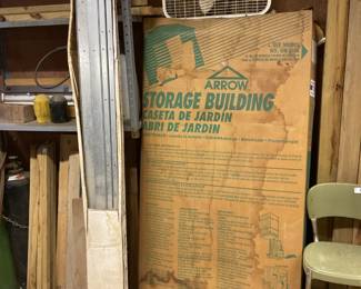 Storage building kit with metal decking pieces