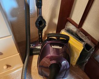 Several vacuums...Kenmore 600 Series Bagged Canister Vacuum. 