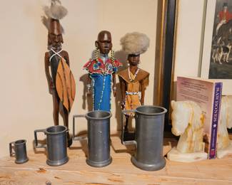 African figures, pewter mugs