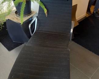 Vintage black fabric and die cast aluminum Ray and Charles Eames EA124 chair and ottoman, ca 1960, minor corner break to frame of ottoman