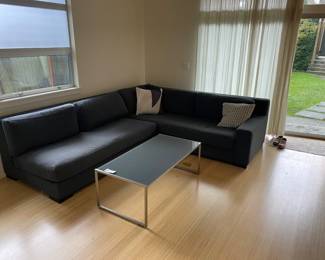 now $1500. $6000. Restoration Hardware Modena Track Arm Right Arm Return Sectional sofa in carbon. Down feather and Para Italian Performance Fabric. Arm to the left in this photo is 6 ft wide by 41 inches deep by 30 inches high. Arm to the right is 8 feet wide by 41 inches deep by 30 inches high. Currently online for $12,790 plus tax and shipping.  Nothing else is available.