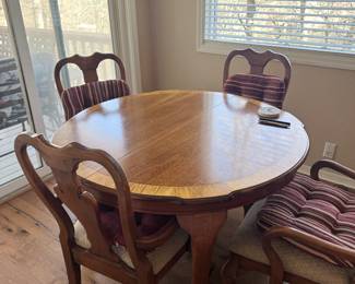 Inlaid wood round table with four chairs