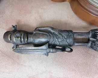 cast iron/metal soldier about 8 inches tall