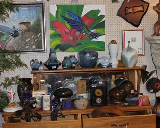 A beautiful piece of furniture holding some of our blues as well as wall art