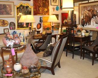 dainty little desk in the back along with some southwestern art