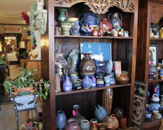 2 beautiful solid wood book cases holding more pottery