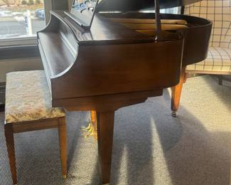 Antique baby grand piano. 