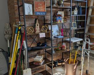 Wood and metal etagere with many decorative items