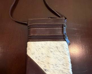 Leather cowhide phone purse.
