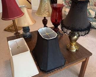 Assorted small lamps and lampshades.