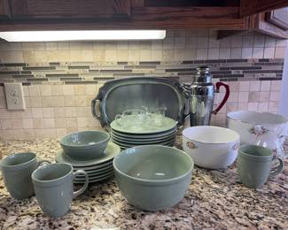 Six dinner plates, one has a chip underneath. Three mugs, six small plates, one serving bowl and one cereal bowl.
Creamer and sugar dishes, two mixing bowls by Hall’s. Silver plate, serving tray and stainless coffee server