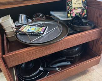 Cary cookbook, 2 pizza pans, 4 small loaf pans, 9" round cake/pie pans, measuring cups.&nbsp;

3 skillets, 2 sauce pans, 1 roasting pan with cover.

Hamilton Beach steamer, Sunbeam blender, griddle, stockpots.
