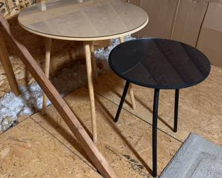Two round craft tables, both with glass top