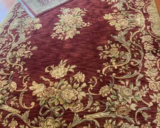 1 large room rug 11’x7'8", rustic red rose pattern with delicate fringe.
1 matching rug 5'x3’6”